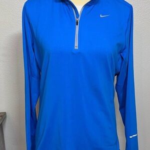 Nike Women's Vibrant Blue Long Sleeve Dri fit 3/4 zip pullover. Size Medium
